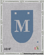 A taped needlepoint canvas with the design: Banner 18 mesh count Rounded M White on Blue.