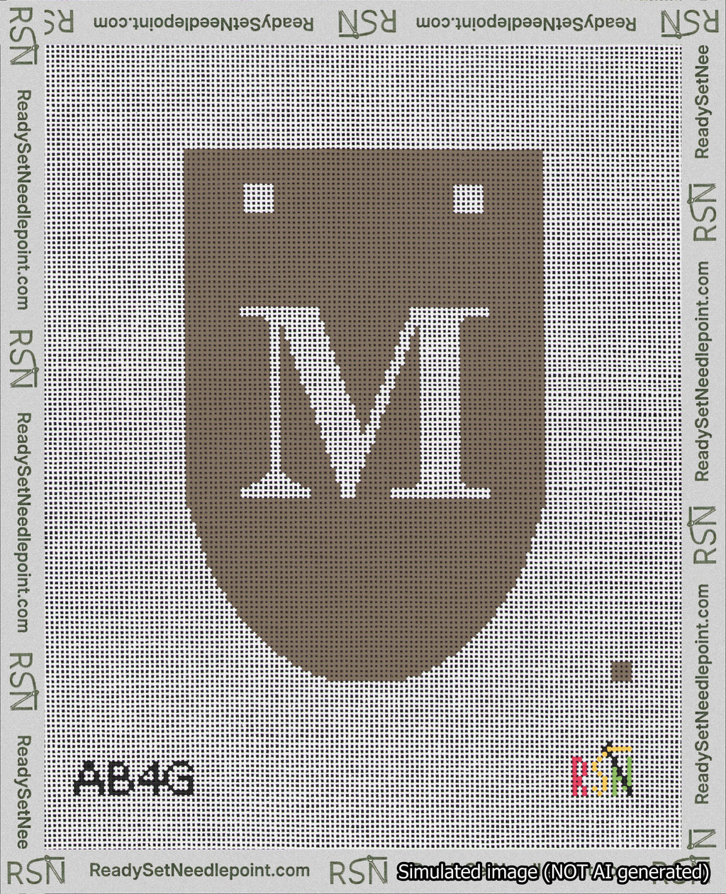 A taped needlepoint canvas with the design: Banner 18 mesh count Rounded M White on Brown.