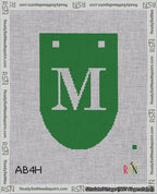 A taped needlepoint canvas with the design: Banner 18 mesh count Rounded M White on Green.