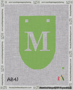 A taped needlepoint canvas with the design: Banner 18 mesh count Rounded M White on Light Green.