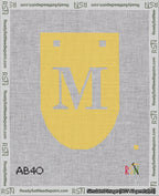 A taped needlepoint canvas with the design: Banner 18 mesh count Rounded M White on Yellow.