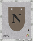 A taped needlepoint canvas with the design: Banner 18 mesh count Rounded N Black on Brown.