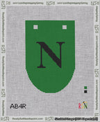 A taped needlepoint canvas with the design: Banner 18 mesh count Rounded N Black on Green.