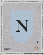 A taped needlepoint canvas with the design: Banner 18 mesh count Rounded N Black on Light Blue.