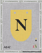 A taped needlepoint canvas with the design: Banner 18 mesh count Rounded N Black on Yellow.