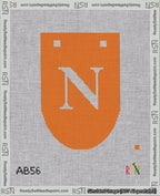 A taped needlepoint canvas with the design: Banner 18 mesh count Rounded N White on Orange.