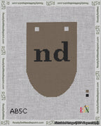 A taped needlepoint canvas with the design: Banner 18 mesh count Rounded nd Black on Brown.