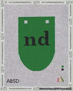 A taped needlepoint canvas with the design: Banner 18 mesh count Rounded nd Black on Green.