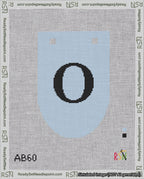 A taped needlepoint canvas with the design: Banner 18 mesh count Rounded O Black on Light Blue.