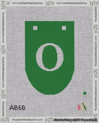 A taped needlepoint canvas with the design: Banner 18 mesh count Rounded O White on Green.
