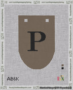 A taped needlepoint canvas with the design: Banner 18 mesh count Rounded P Black on Brown.