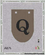 A taped needlepoint canvas with the design: Banner 18 mesh count Rounded Q Black on Brown.