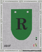 A taped needlepoint canvas with the design: Banner 18 mesh count Rounded R Black on Green.