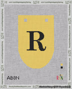 A taped needlepoint canvas with the design: Banner 18 mesh count Rounded R Black on Yellow.