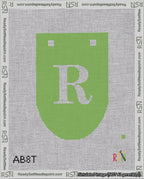 A taped needlepoint canvas with the design: Banner 18 mesh count Rounded R White on Light Green.