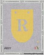 A taped needlepoint canvas with the design: Banner 18 mesh count Rounded R White on Yellow.