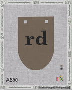 A taped needlepoint canvas with the design: Banner 18 mesh count Rounded rd Black on Brown.