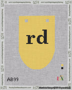 A taped needlepoint canvas with the design: Banner 18 mesh count Rounded rd Black on Yellow.