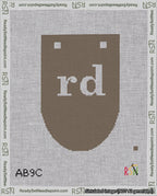 A taped needlepoint canvas with the design: Banner 18 mesh count Rounded rd White on Brown.