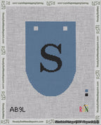 A taped needlepoint canvas with the design: Banner 18 mesh count Rounded S Black on Blue.