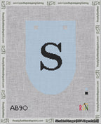 A taped needlepoint canvas with the design: Banner 18 mesh count Rounded S Black on Light Blue.