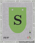 A taped needlepoint canvas with the design: Banner 18 mesh count Rounded S Black on Light Green.