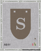 A taped needlepoint canvas with the design: Banner 18 mesh count Rounded S White on Brown.