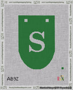 A taped needlepoint canvas with the design: Banner 18 mesh count Rounded S White on Green.