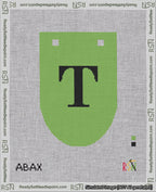 A taped needlepoint canvas with the design: Banner 18 mesh count Rounded T Black on Light Green.