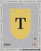 A taped needlepoint canvas with the design: Banner 18 mesh count Rounded T Black on Yellow.