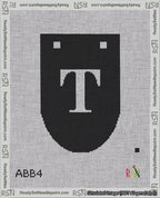 A taped needlepoint canvas with the design: Banner 18 mesh count Rounded T White on Black.