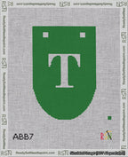 A taped needlepoint canvas with the design: Banner 18 mesh count Rounded T White on Green.