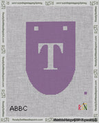 A taped needlepoint canvas with the design: Banner 18 mesh count Rounded T White on Purple.