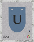 A taped needlepoint canvas with the design: Banner 18 mesh count Rounded U Black on Blue.