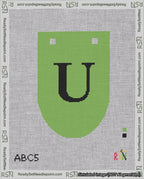 A taped needlepoint canvas with the design: Banner 18 mesh count Rounded U Black on Light Green.