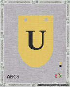 A taped needlepoint canvas with the design: Banner 18 mesh count Rounded U Black on Yellow.