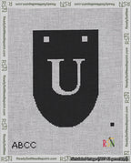 A taped needlepoint canvas with the design: Banner 18 mesh count Rounded U White on Black.