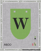 A taped needlepoint canvas with the design: Banner 18 mesh count Rounded W Black on Light Green.