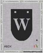 A taped needlepoint canvas with the design: Banner 18 mesh count Rounded W White on Black.