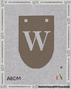 A taped needlepoint canvas with the design: Banner 18 mesh count Rounded W White on Brown.