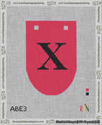 A taped needlepoint canvas with the design: Banner 18 mesh count Rounded X Black on Red.
