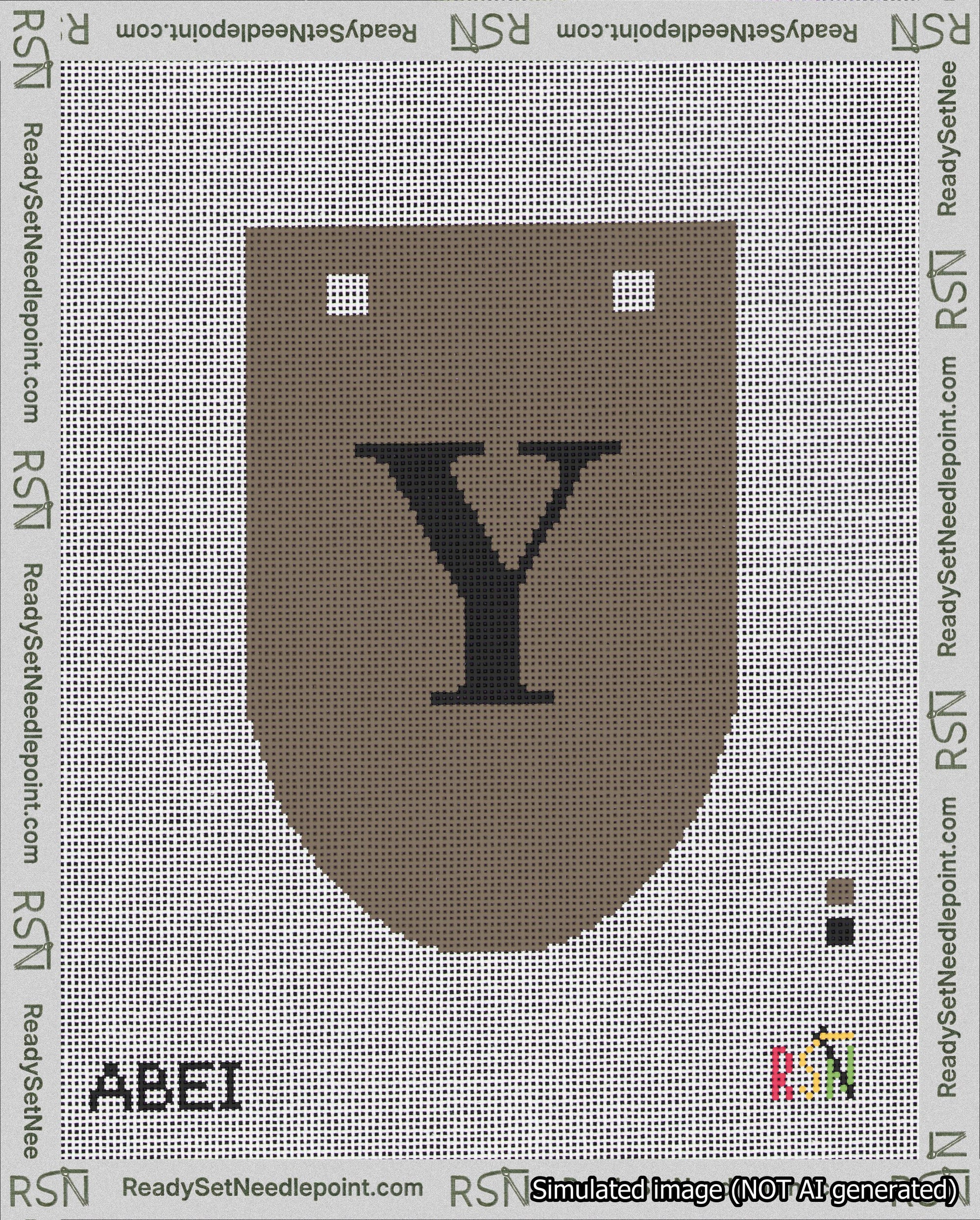 A taped needlepoint canvas with the design: Banner 18 mesh count Rounded Y Black on Brown.
