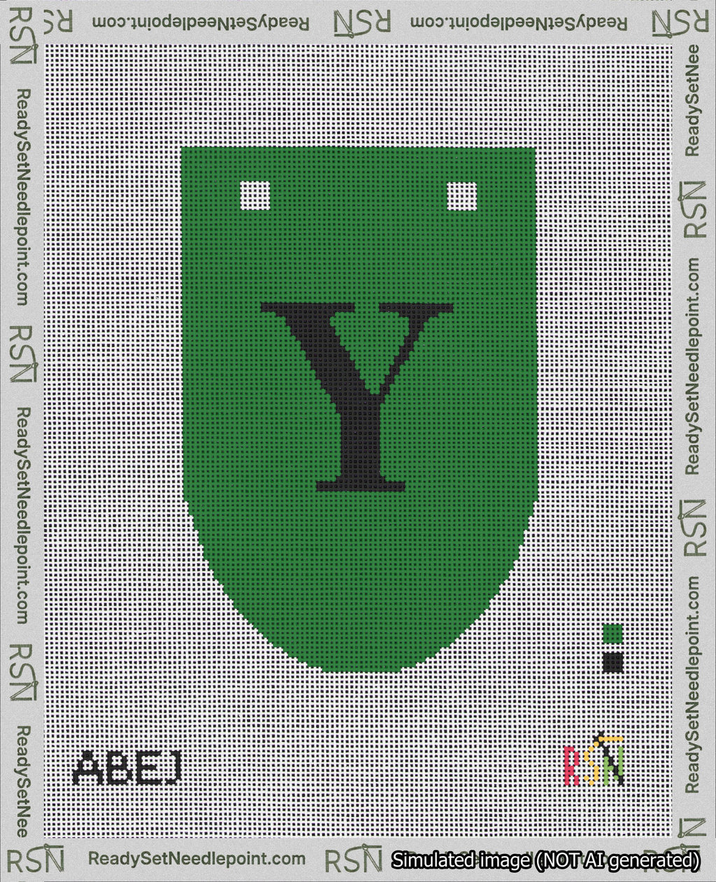A taped needlepoint canvas with the design: Banner 18 mesh count Rounded Y Black on Green.