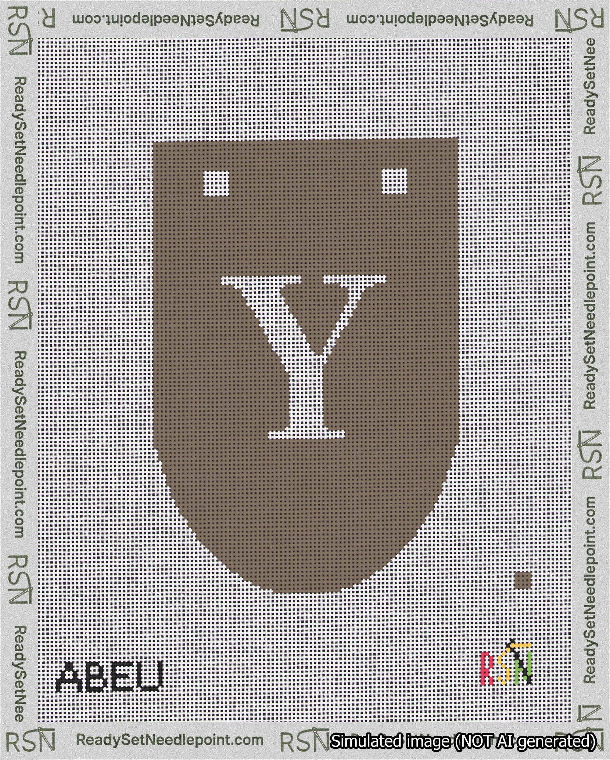 A taped needlepoint canvas with the design: Banner 18 mesh count Rounded Y White on Brown.