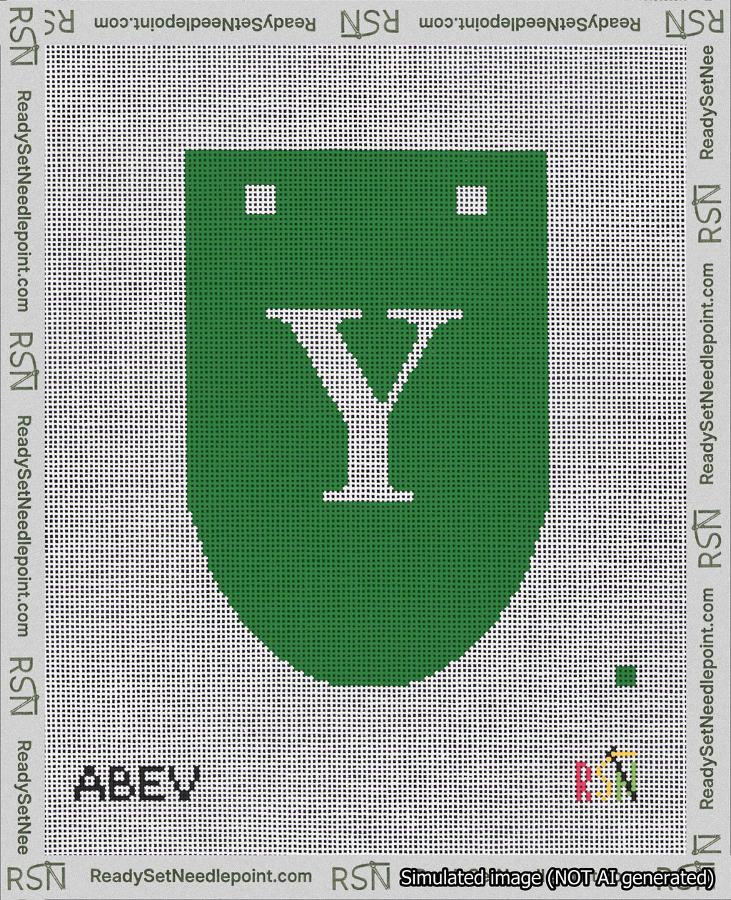 A taped needlepoint canvas with the design: Banner 18 mesh count Rounded Y White on Green.