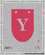 A taped needlepoint canvas with the design: Banner 18 mesh count Rounded Y White on Red.