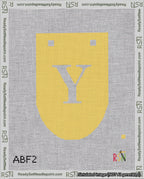 A taped needlepoint canvas with the design: Banner 18 mesh count Rounded Y White on Yellow.