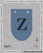 A taped needlepoint canvas with the design: Banner 18 mesh count Rounded Z Black on Blue.