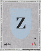 A taped needlepoint canvas with the design: Banner 18 mesh count Rounded Z Black on Light Blue.