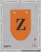 A taped needlepoint canvas with the design: Banner 18 mesh count Rounded Z Black on Orange.